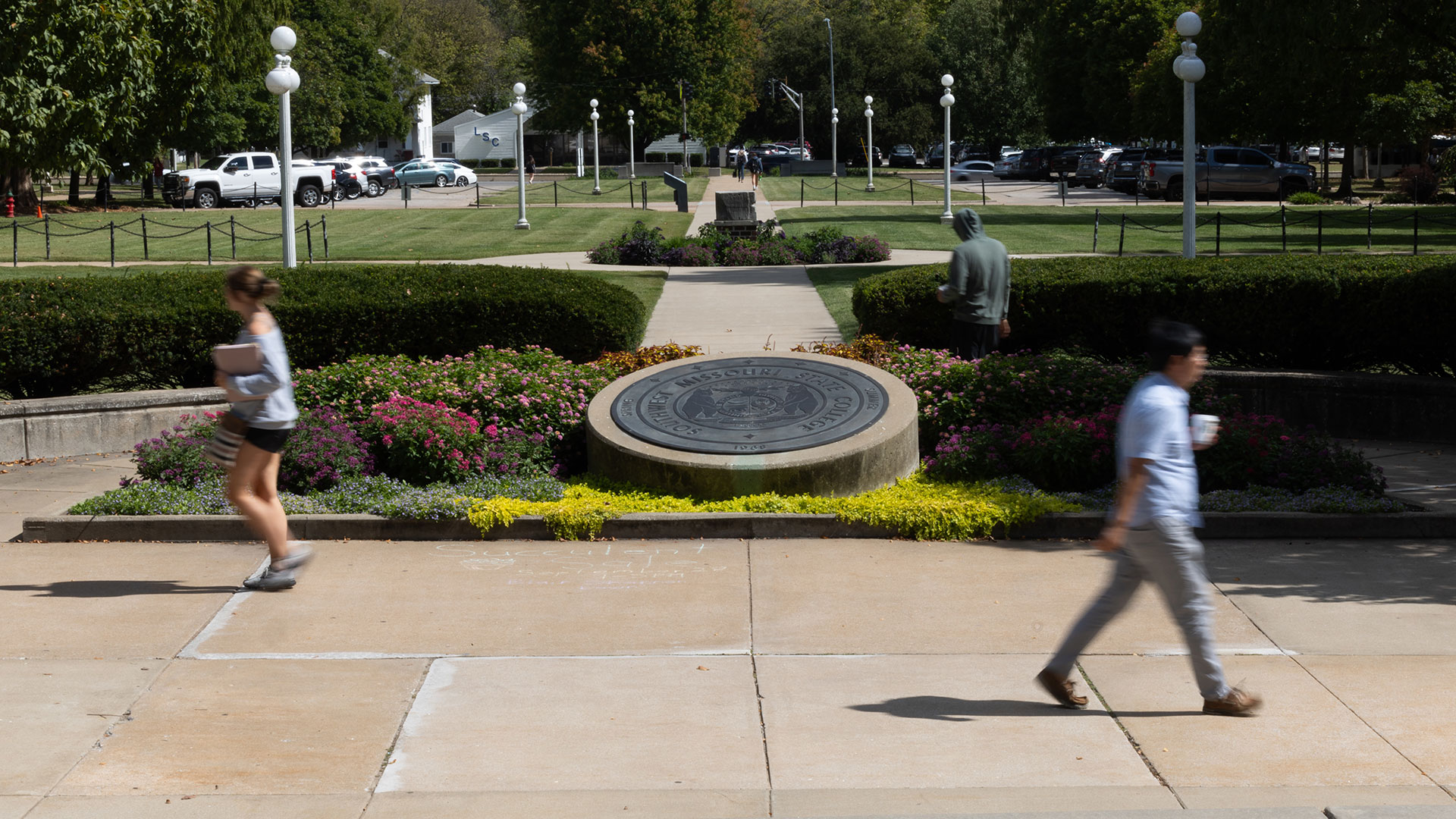 Students and faculty walking across campus