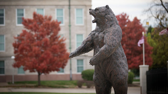 Fall campus scene with one of MSU's bear statues