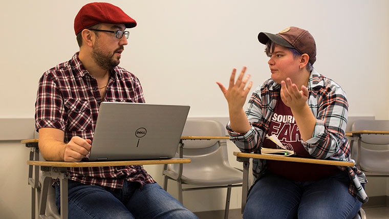 Students discussing script.