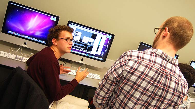 Students talking in media lab.