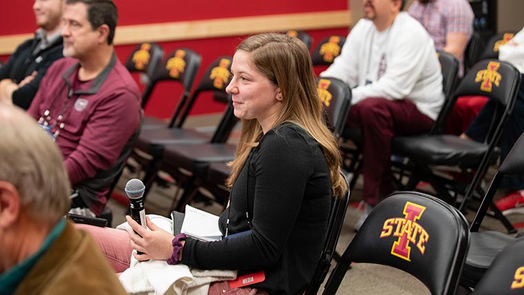 Student reporter in press conference room. 