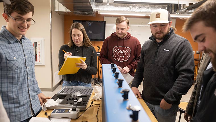 Group of engineering students working on a lab activity.