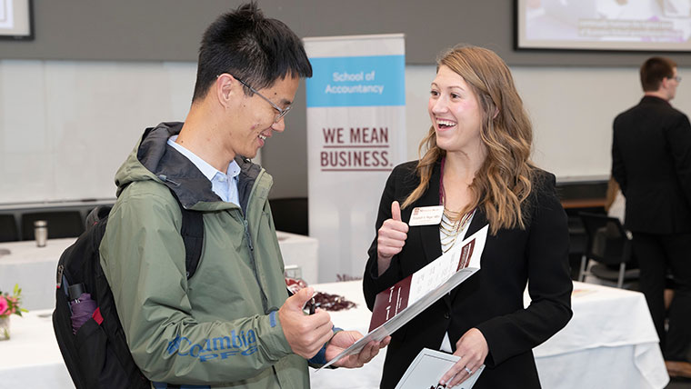 Two students discussing the business program at Missouri State.