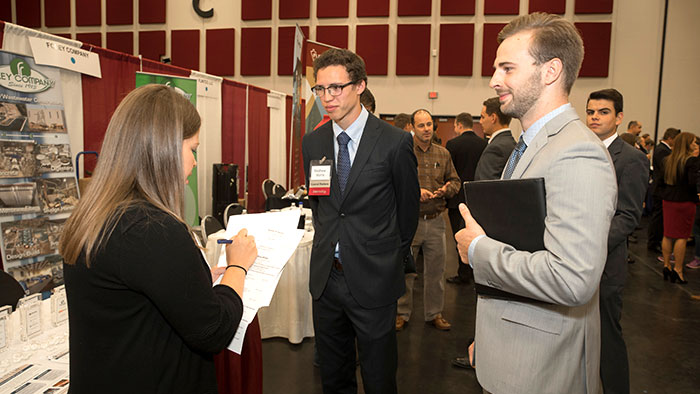 People in business attire at a career fair