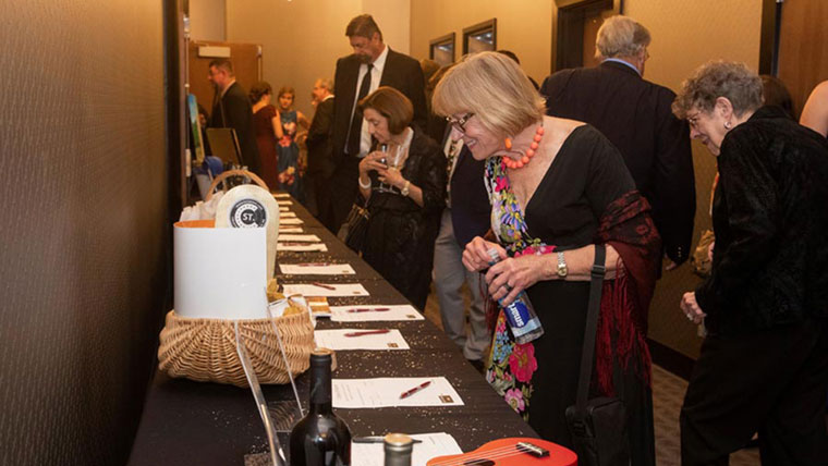 Choral Gala attendees peruse silent auction items