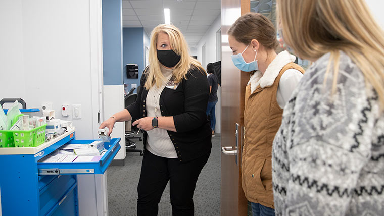 Nursing professor showing students supply stash.