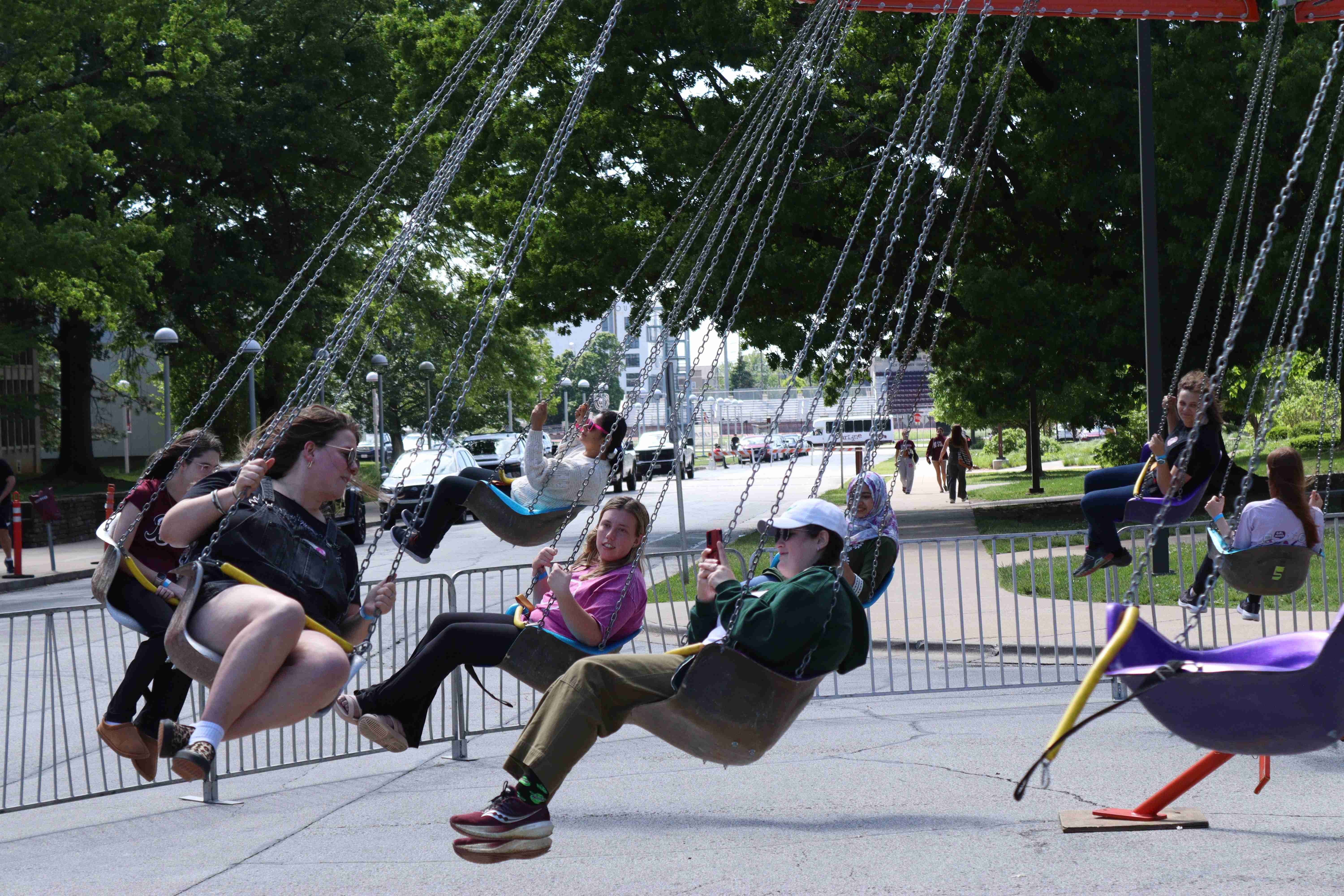 Students on a carnival ride at SAC annual event May Day