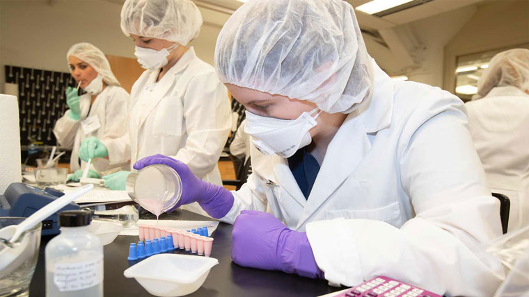 Students working on a lab in a classroom.