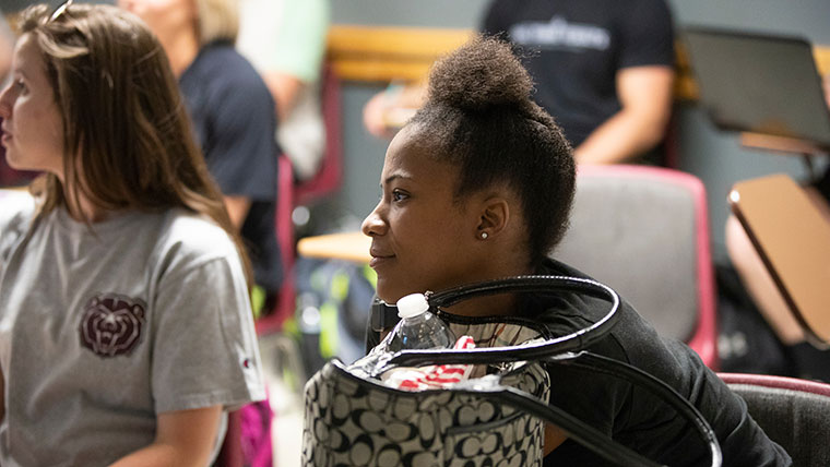 Students listening in class.