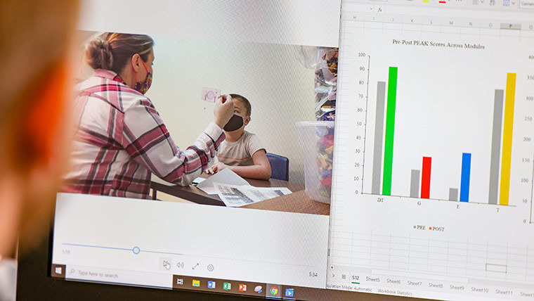 Student examining patient photos and a graph.