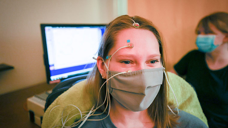 Psychology students doing an experiment that tests brain waves.