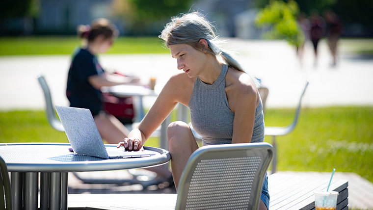 Student studying outside.