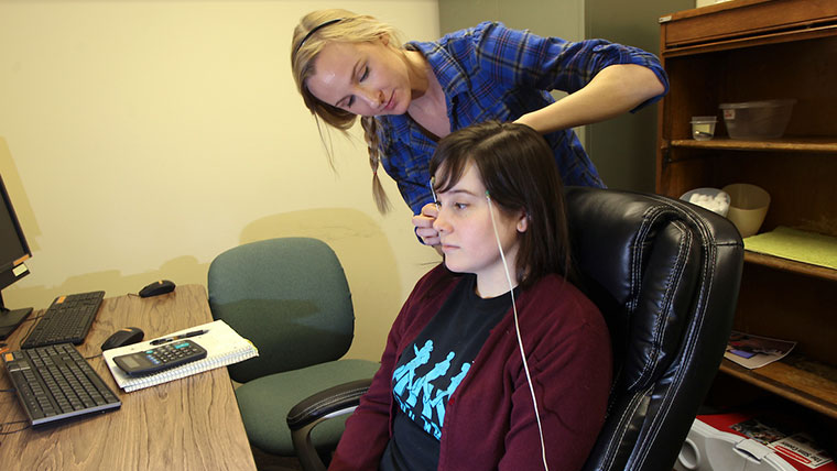 Missouri State student conducting a test with another student