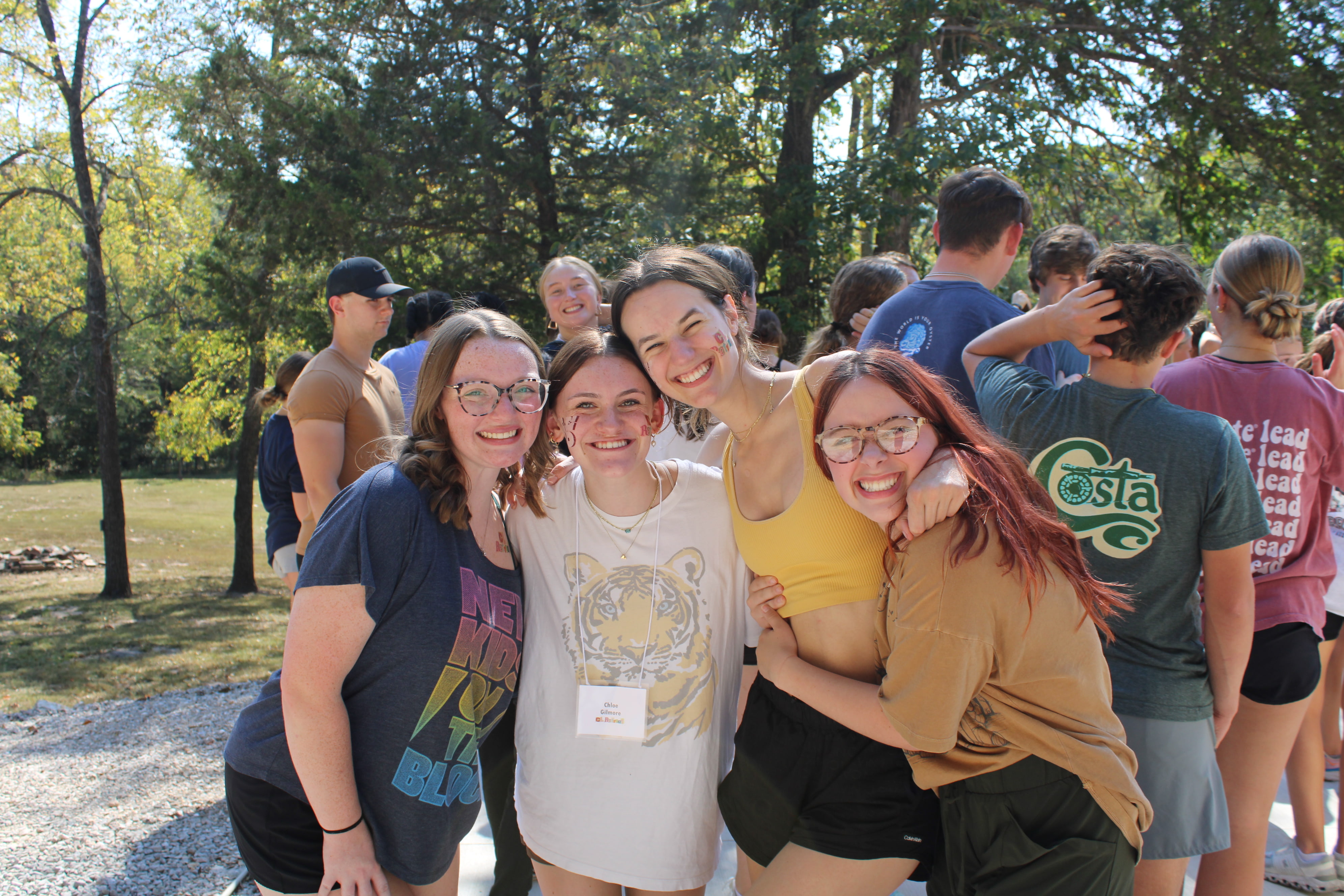 Four Centennial Leaders smiling for a photo