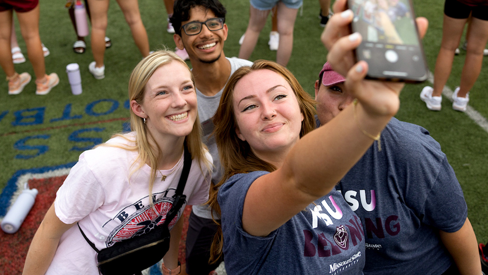 four students taking a selfie