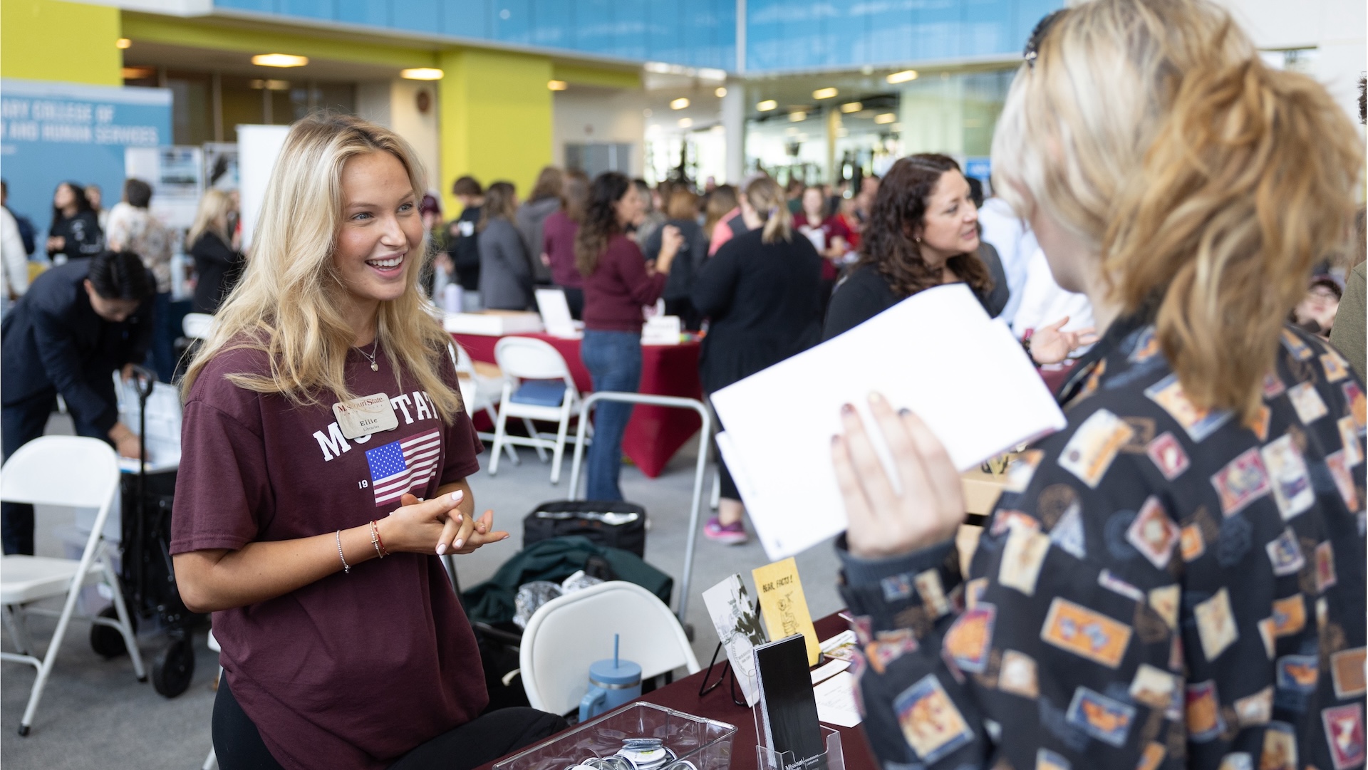 An advising student discussing majors with a prospective student. 